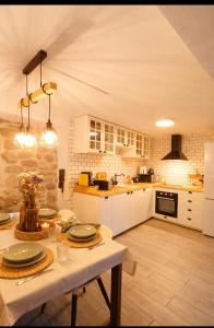 a kitchen with a table with plates on it at Casa Martinho & Neves in Seia