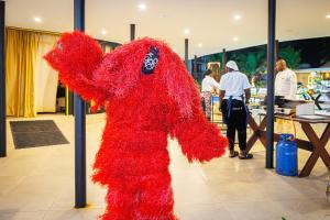 a red teddy bear is standing in a store at Kombo Beach Resort in Serekunda