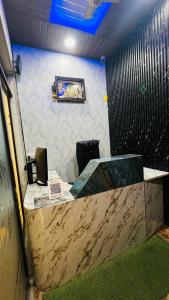 a reception desk in a office with a counter top at Hotel Stay Inn Lucknow Airport VIP Terminal in Lucknow