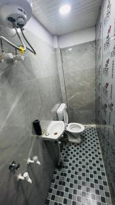 a bathroom with a toilet and a sink at Hotel Stay Inn Lucknow Airport VIP Terminal in Lucknow