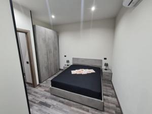 a room with a bed in the middle of it at L'Angolo Felice in Riposto