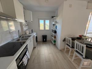 a kitchen with a sink and a counter top at Casa Rebeca in Torre de Benagalbón
