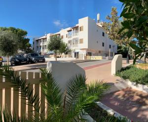 a view of a street with a building at Apartamentos, Edificio Pujolets Es Pujols-Playa in Es Pujols