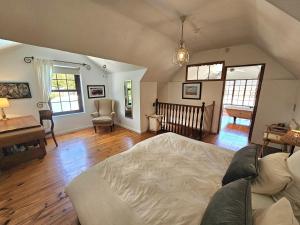 a large living room with a bed and a table and chairs at The Gables in Hout Bay +21 photos
