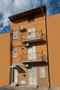 a building with two balconies on the side of it at Asaro Camere in Campobello di Licata