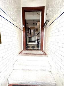 a stairway leading into a hallway with a doorway at The Traveler Suite C1 in Hartford