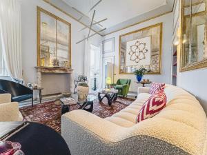 a living room with a couch and a fireplace at Luxury Apartment in Lucca in Lucca