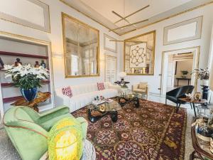 a living room with a couch and a table at Luxury Apartment in Lucca in Lucca