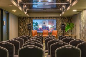 an empty conference room with chairs and a stage at Lennox Buenos Aires in Buenos Aires