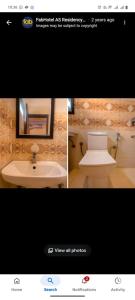 a bathroom with a white toilet and a sink at As Residency in Dehradun