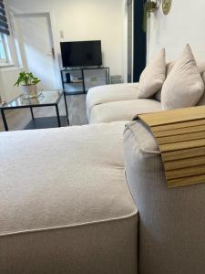 a living room with two beds and a couch at Altstadt-Hotel Gosequell in Goslar