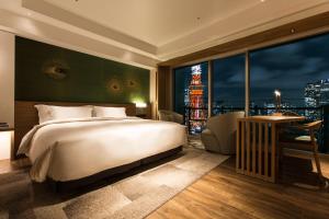 a bedroom with a large bed and a large window at The Prince Park Tower Tokyo - Preferred Hotels & Resorts, LVX Collection in Tokyo