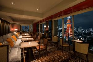 a restaurant with a view of the eiffel tower at The Prince Park Tower Tokyo - Preferred Hotels & Resorts, LVX Collection in Tokyo