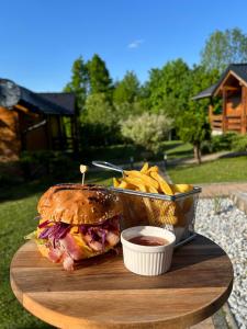 a sandwich and french fries and a bowl of ketchup at Studio Apartment Žafran in Smoljanac