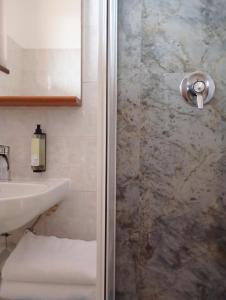 a bathroom with a shower and a sink at Il Leone D'Oro in Telgate +97 photos