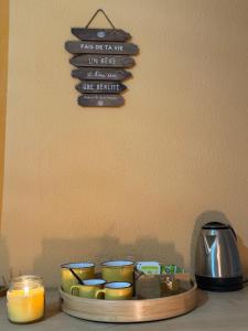 a tray of candles on a table with a sign at Il Gelso Bianco in Bordighera