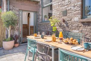 a wooden table with chairs on a patio at 5 Bed in Bwlch oc-p32273 in Bwlch