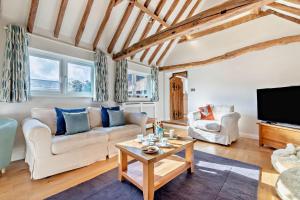a living room with two couches and a tv at 4 Bed in Flimwell oc-g30190 in Ticehurst