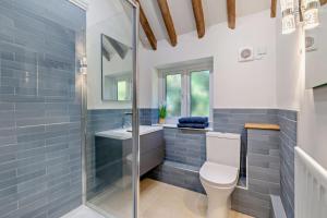 a bathroom with a toilet and a sink at 4 Bed in Flimwell oc-g30190 in Ticehurst +20 photos