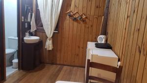 a bathroom with a sink and a toilet at Holo Pousada Vale Encantado in Rancho Queimado +157 photos