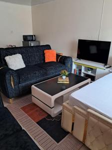 a living room with a couch and a coffee table at Watene's Homes in Nairobi