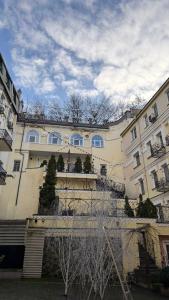 a large building with windows on the side of it at Old Town - Andrew descent in Kyiv