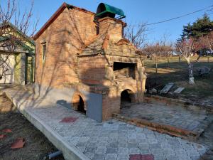 an old brick oven sitting on a patio at Ranč Petar Alavanja Banstol in Sremski Karlovci