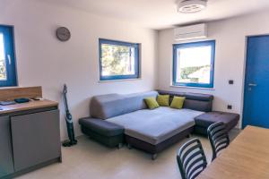 a living room with a couch and a table at Vila JELSANA in Jelsa +57 photos