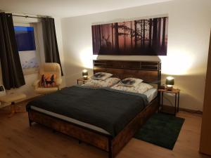 a bedroom with a large bed in a room at Haus Flora in Hasselfelde