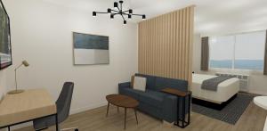 a small living room with a bed and a couch at XStay Suites Mansfield in Mansfield