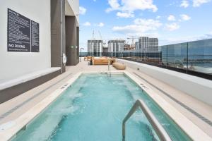 a hot tub on the roof of a building at Stylish Studio in Downtown Location in Miami