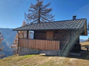 a small cabin on the side of a hill at Samalmglück in Maria Luggau