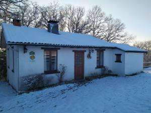 a small white house with snow on the roof at La Bergerie in Froid-Chapelle +22 photos