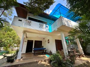 a view of a house with a balcony at Nelum Vegan House in Bentota