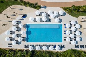 an overhead view of a swimming pool with white architecture at Ocean Allure Costa Mujeres - Adults Only - All Inclusive in Costa Mujeres