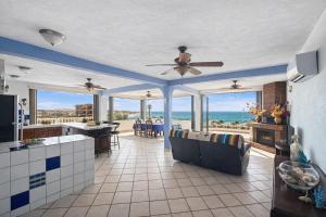 a large kitchen with a view of the ocean at Penthouse Water View in Puerto Peñasco