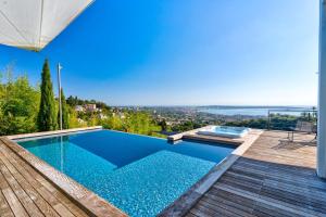 a swimming pool in a house with a view at Villa Bambou bei Cannes mit Blick auf Cap Antibes in Vallauris