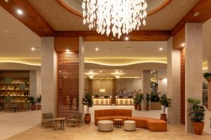 a lobby of a hotel with a chandelier at Riu Ventura - All Inclusive in Cancún +195 photos