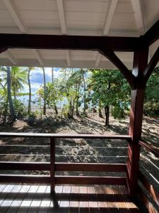 a view from the porch of a house at Bungalow sur la plage in Le Carbet