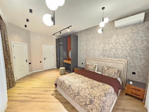 a bedroom with a bed and a wall at Villa Wolverine in Gabala +19 photos