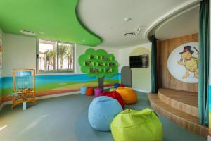a childrens room with a staircase and colorful walls at Riu Ventura - All Inclusive in Cancún
