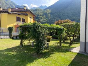 a house with a bunch of ivy growing around it at CA' DEI PAOLI in Pieve Vergonte
