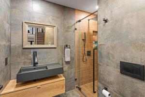 a bathroom with a sink and a shower at Pine Breeze in Pocono Pines +121 photos