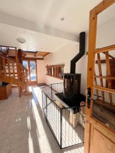 a kitchen with a stove in the middle of a room at L'Entre Monts in Saint-Pierre-dʼEntremont