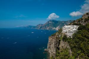 a view of the amalfi coast with buildings on a mountain at Grand Hotel Tritone in Praiano +144 photos