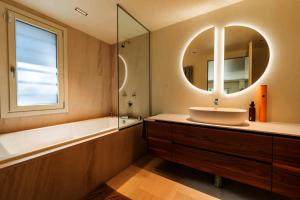 a bathroom with a sink and a mirror at Savusavu Sea View in Savusavu
