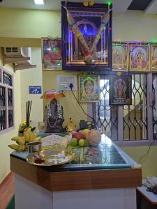 a kitchen counter with a plate of food on it at JB lodge in Chidambaram