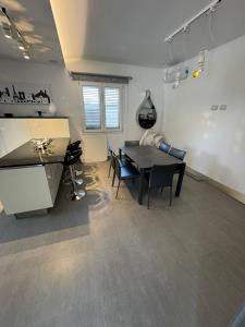 a living room with a table and a dining room at Villa Panama con piscina - Mazara del vallo in Mazara del Vallo