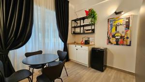 a small dining room with a table and chairs at Talenti Suites Rome Casa Vacanze in Rome