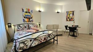 a bedroom with a bed and a table in it at Talenti Suites Rome Casa Vacanze in Rome